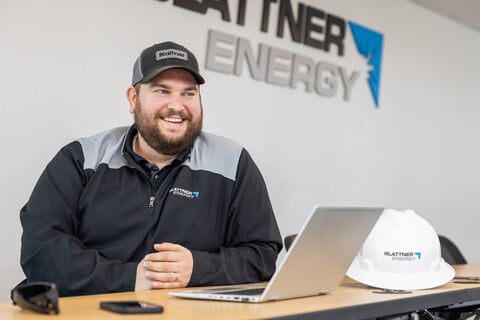 smiling male with laptop